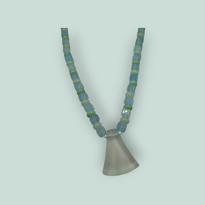 The Salty Bead Co handcrafted necklace with light blue and sage green glass beads and a frosted flared glass pendant.