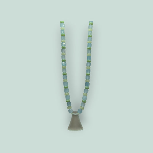The Salty Bead Co handcrafted necklace with light blue and sage green glass beads and a frosted flared glass pendant.