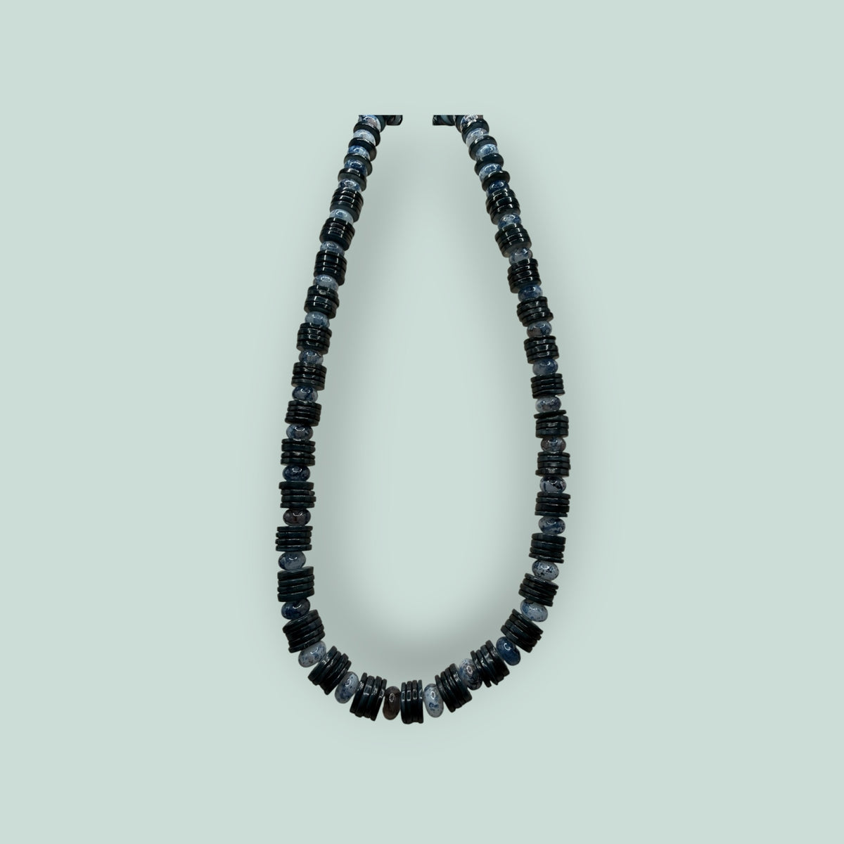 The Salty Bead Co handcrafted necklace with alternating polished black disc beads and mottled grey stone beads.