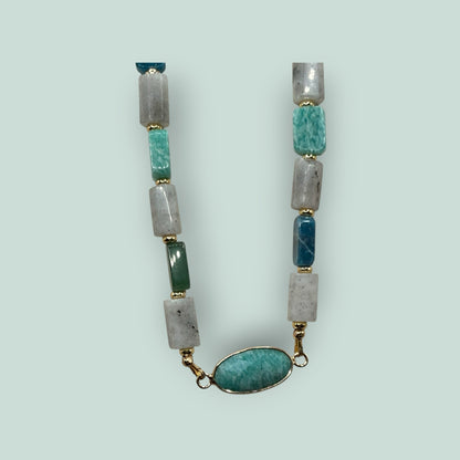 The Salty Bead Co handcrafted gemstone necklace with rectangular sage, green, and grey stones and an oval pendant.
