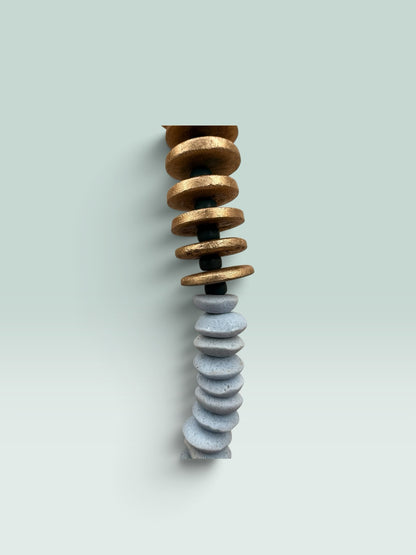 The Salty Bead Co handcrafted statement necklace featuring gold-toned and slate-grey flattened disc beads.