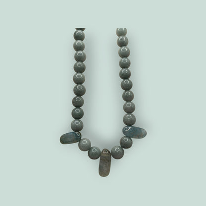 The Salty Bead Co handcrafted grey stone beaded necklace with elongated accent stones and a minimalist design.