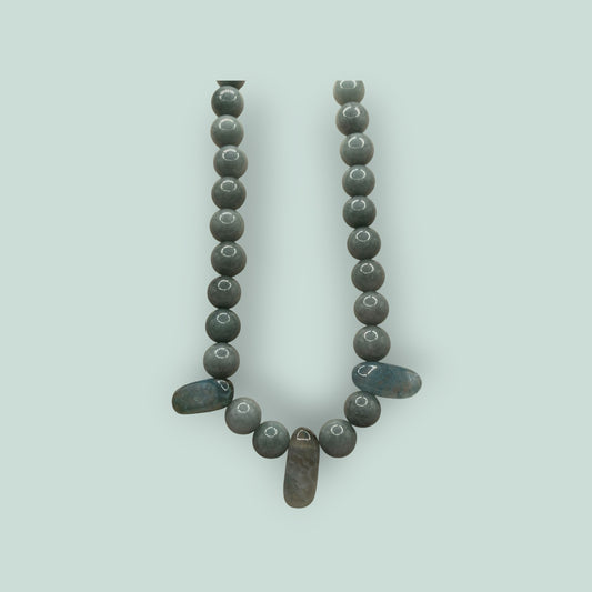 The Salty Bead Co handcrafted grey stone beaded necklace with elongated accent stones and a minimalist design.