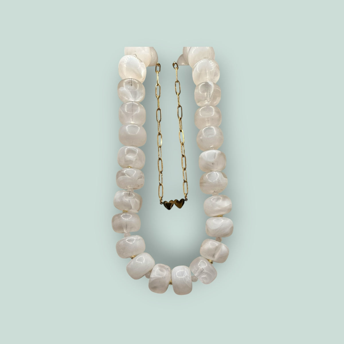 The Salty Bead Co handcrafted statement necklace with milky white semi-translucent beads and gold-toned spacers.