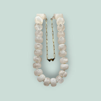 The Salty Bead Co handcrafted statement necklace with milky white semi-translucent beads and gold-toned spacers.