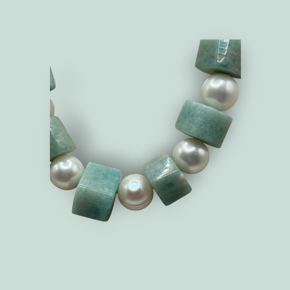 The Salty Bead Co handcrafted necklace featuring alternating freshwater pearls and cube-cut green gemstone beads.