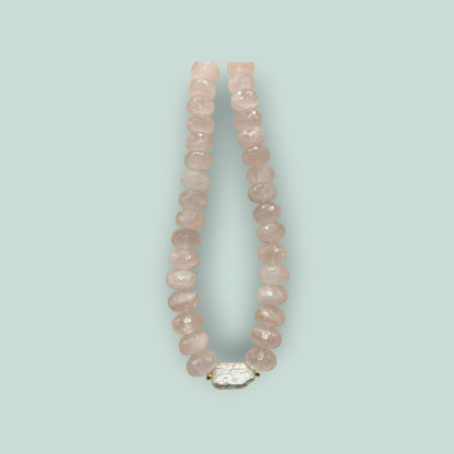 The Salty Bead Co handcrafted necklace with faceted rose quartz beads and a central organic baroque pearl accent.