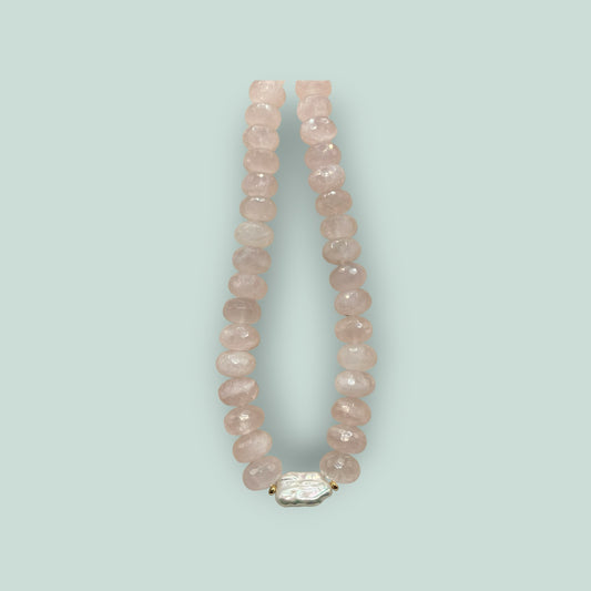 The Salty Bead Co handcrafted necklace with faceted rose quartz beads and a central organic baroque pearl accent.