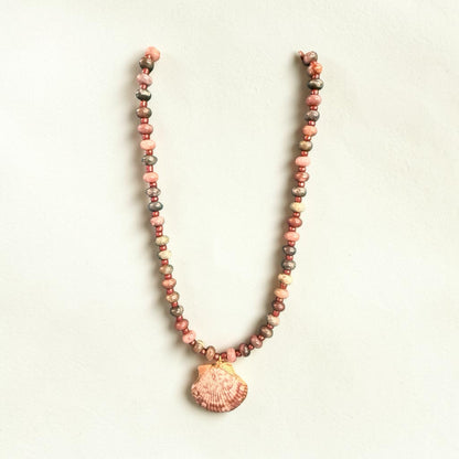 The Salty Bead Co handcrafted necklace with a natural seashell pendant and dusty rose and grey semi-precious beads.