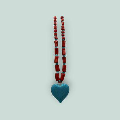 The Salty Bead Co artisan heart pendant necklace with red coral-style beads and a textured turquoise heart charm.